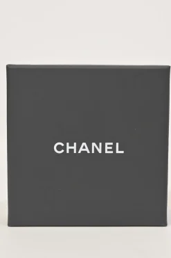 Gold-finish metal and leather Coco Mark brooch