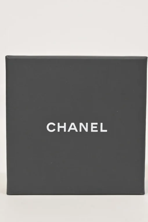 Gold-finish metal and leather Coco Mark brooch
