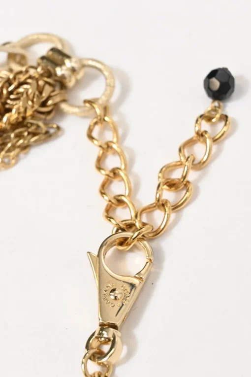 Gold-finish metal and resin faux pearl charm bib necklace with lobster clasp closure