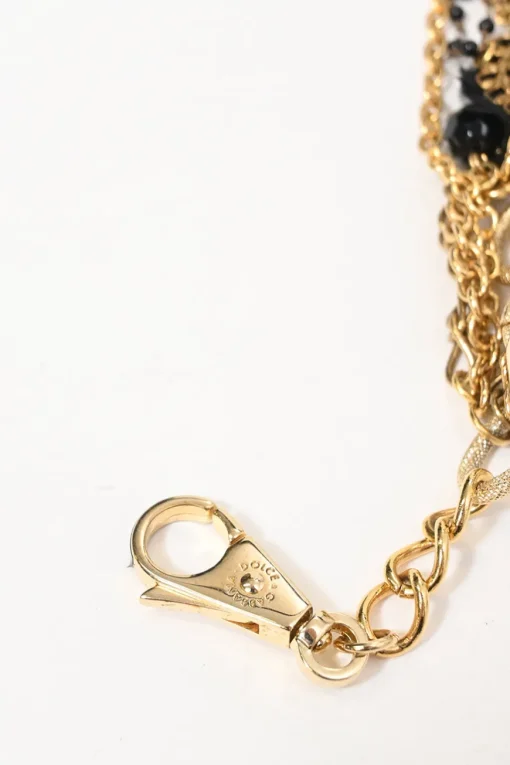 Gold-finish metal and resin faux pearl charm bib necklace with lobster clasp closure