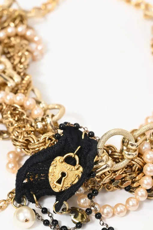Gold-finish metal and resin faux pearl charm bib necklace with lobster clasp closure
