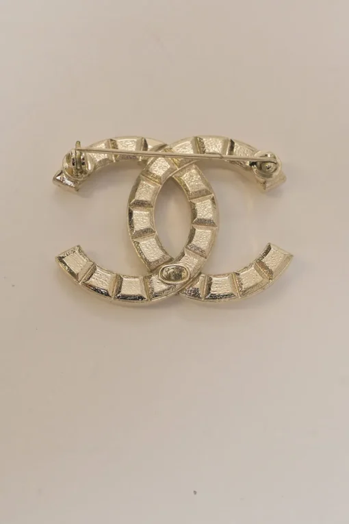 Gold-finish metal Coco Mark brooch
