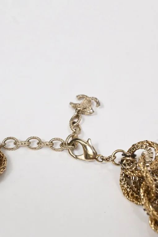 Gold-finish metal multi-strand twist chain bracelet with strass Coco Mark motif