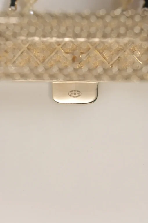 Gold-finish metal, resin, and leather micro flap bag crossbody bag necklace with faux pear and chainlink strap