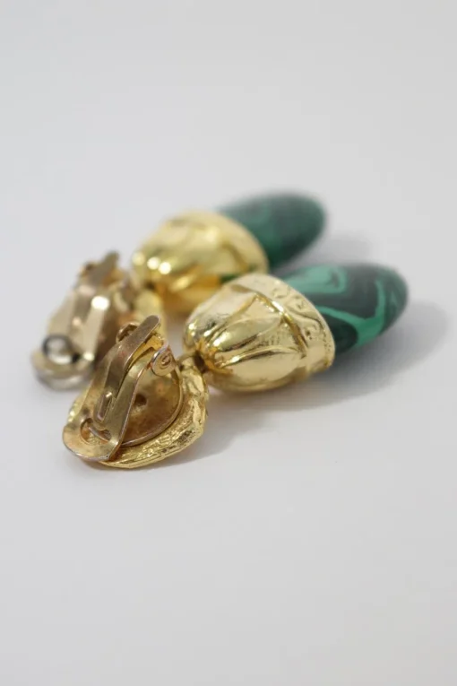 gold-plated ear clip with dangling green stones