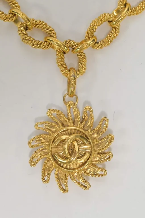 Gold-plated metal 94A Coco Mark sun medallion pendant chain bracelet with T-bar closure