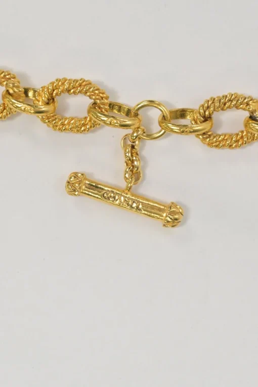 Gold-plated metal 94A Coco Mark sun medallion pendant chain bracelet with T-bar closure