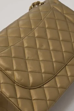 Gold-tone foiled matelassé leather 2012-2013 Jumbo double flap shoulder bag with gold-tone metallic hardware