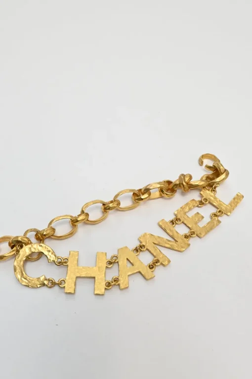 Gold-tone hammered metal chunky logo charm chain belt