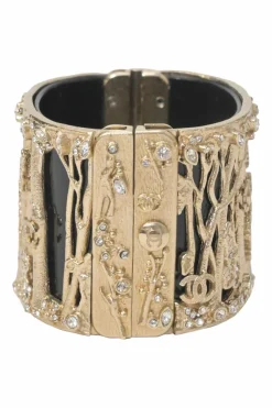 Gold-tone metal cherry forest filigree strass and black resin hinged cuff bracelet