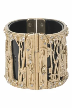 Gold-tone metal cherry forest filigree strass and black resin hinged cuff bracelet
