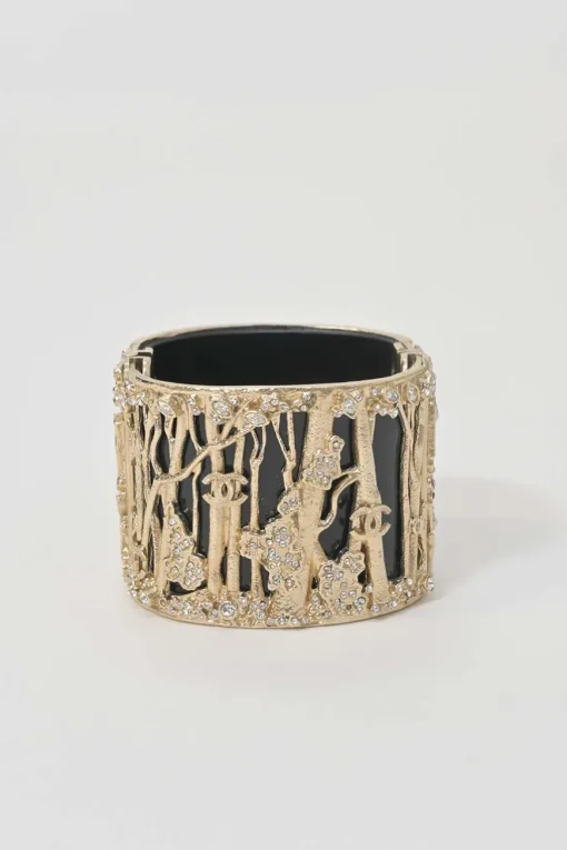 Gold-tone metal cherry forest filigree strass and black resin hinged cuff bracelet
