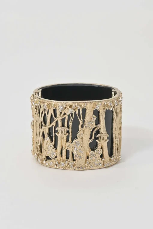 Gold-tone metal cherry forest filigree strass and black resin hinged cuff bracelet