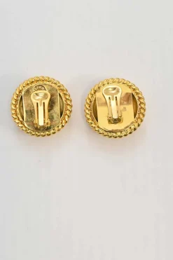 Gold-tone metallic clip-on dome earrings with braided edges