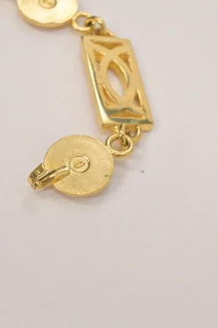 Gold-tone metallic Medusa medallion chain belt with hook fastening