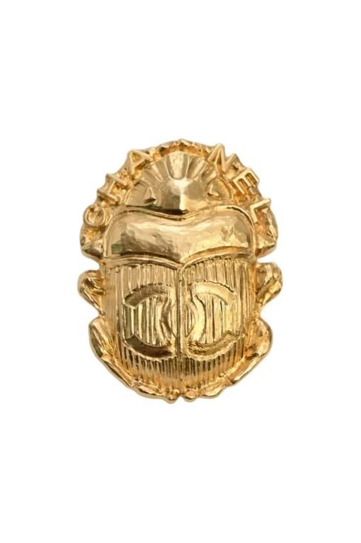 Gold-tone metallic rhinoceros beetle brooch