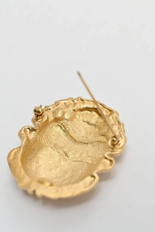 Gold-tone metallic rhinoceros beetle brooch