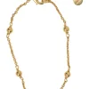 Gold-tone permabrass Petit CD charm bracelet with lobster clasp closure
