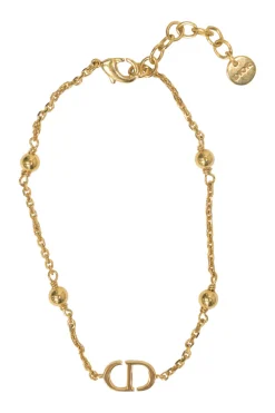 Gold-tone permabrass Petit CD charm bracelet with lobster clasp closure