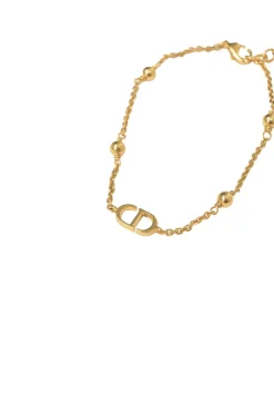 Gold-tone permabrass Petit CD charm bracelet with lobster clasp closure