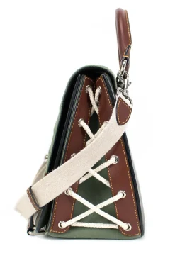 Green and brown leather top satchel bag with silver metal detail on the fabric flap and detachable fabric shoulder strap.