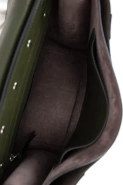 Green and brown leather top satchel bag with silver metal detail on the fabric flap and detachable fabric shoulder strap.