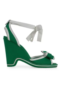Green and white fabric wedges with ribbon on the vamp