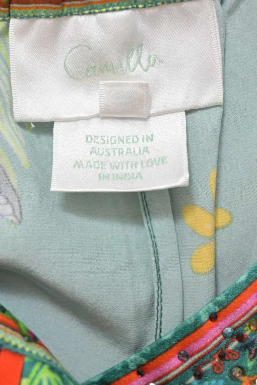 Green botanic print lounge shorts featuring contrasting piping details
