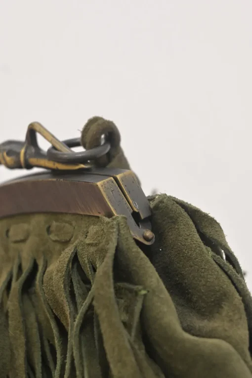 Green fringe suede purse with bent metallic bamboo handle and jade pendant