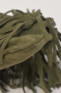 Green fringe suede purse with bent metallic bamboo handle and jade pendant