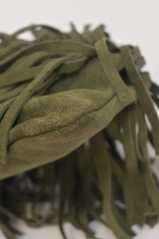 Green fringe suede purse with bent metallic bamboo handle and jade pendant