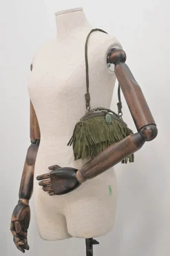 Green fringe suede purse with bent metallic bamboo handle and jade pendant