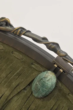 Green fringe suede purse with bent metallic bamboo handle and jade pendant