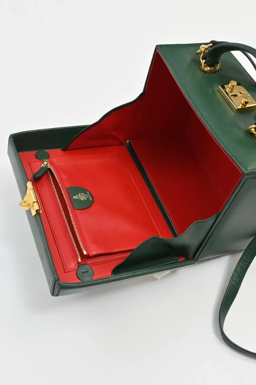Green leather Grace top handle box purse with gold-plated brass hardware and detachable shoulder strap