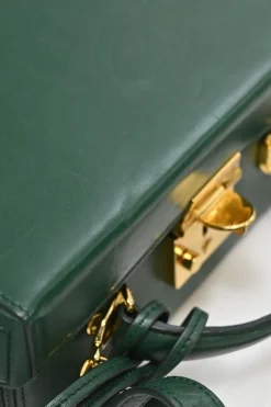 Green leather Grace top handle box purse with gold-plated brass hardware and detachable shoulder strap