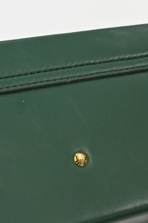 Green leather Grace top handle box purse with gold-plated brass hardware and detachable shoulder strap