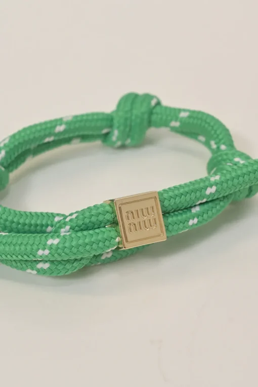 Green nylon and cord rope bracelet with gold-finish metallic logo plaque