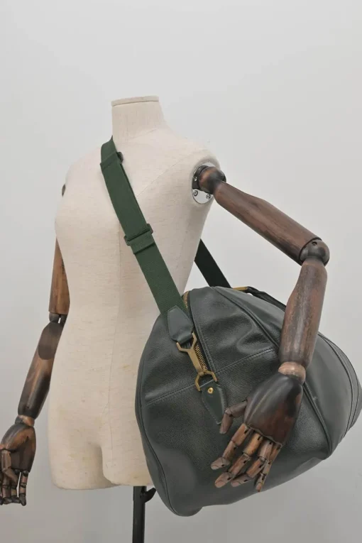 Green Taiga leather Kendall convertible weekender bag with detachable shoulder strap