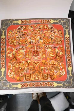 Grey and orange silk 'Folklore' 140 scarf featuring original artwork by Henri d'Origny