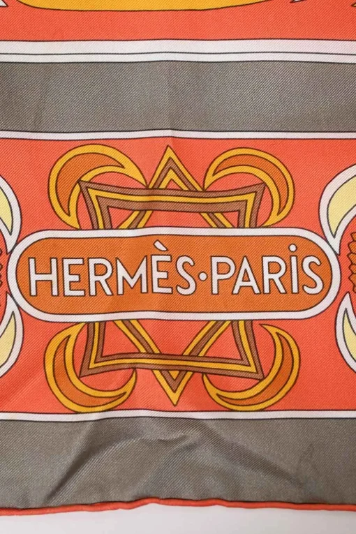Grey and orange silk 'Folklore' 140 scarf featuring original artwork by Henri d'Origny