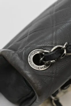 Grey embossed matelassé calfskin crossbody flap bag with gunmetal Coco Mark turnlock closure