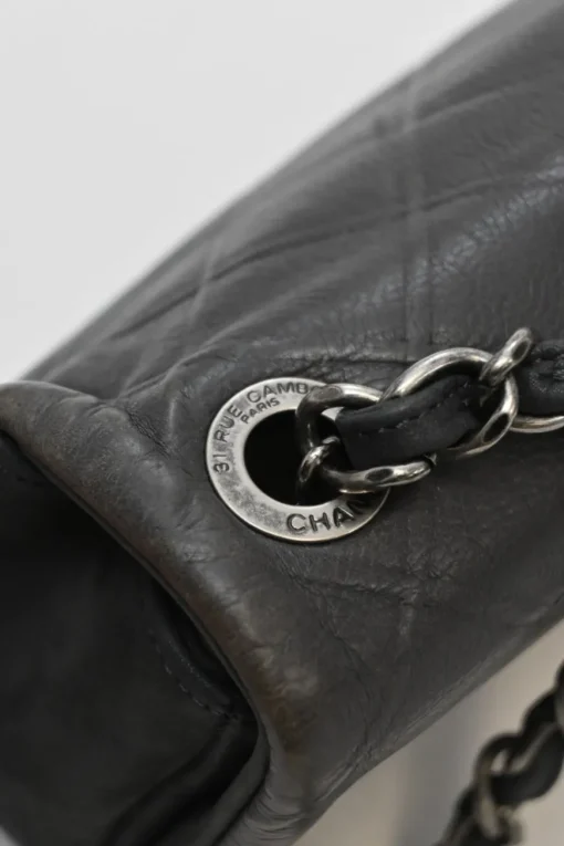 Grey embossed matelassé calfskin crossbody flap bag with gunmetal Coco Mark turnlock closure