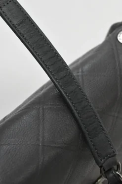 Grey embossed matelassé calfskin crossbody flap bag with gunmetal Coco Mark turnlock closure