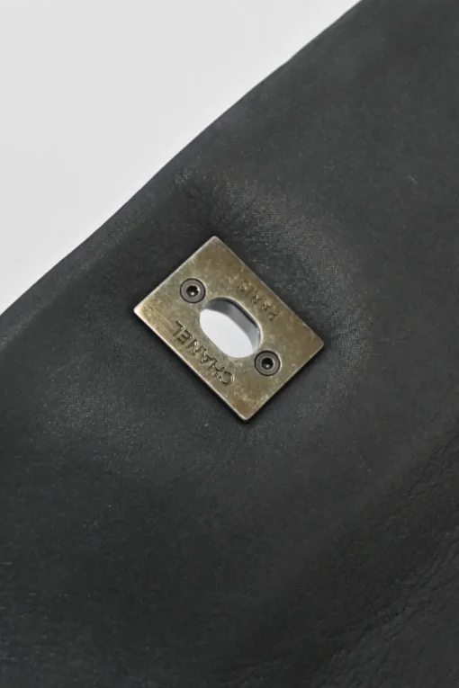 Grey embossed matelassé calfskin crossbody flap bag with gunmetal Coco Mark turnlock closure