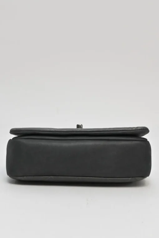Grey embossed matelassé calfskin crossbody flap bag with gunmetal Coco Mark turnlock closure