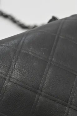 Grey embossed matelassé calfskin crossbody flap bag with gunmetal Coco Mark turnlock closure