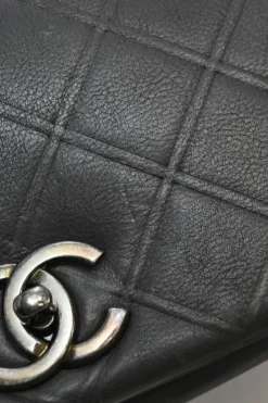Grey embossed matelassé calfskin crossbody flap bag with gunmetal Coco Mark turnlock closure