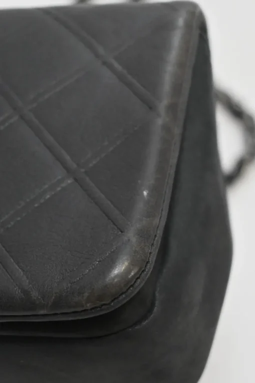 Grey embossed matelassé calfskin crossbody flap bag with gunmetal Coco Mark turnlock closure