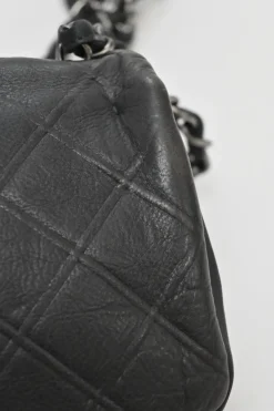Grey embossed matelassé calfskin crossbody flap bag with gunmetal Coco Mark turnlock closure