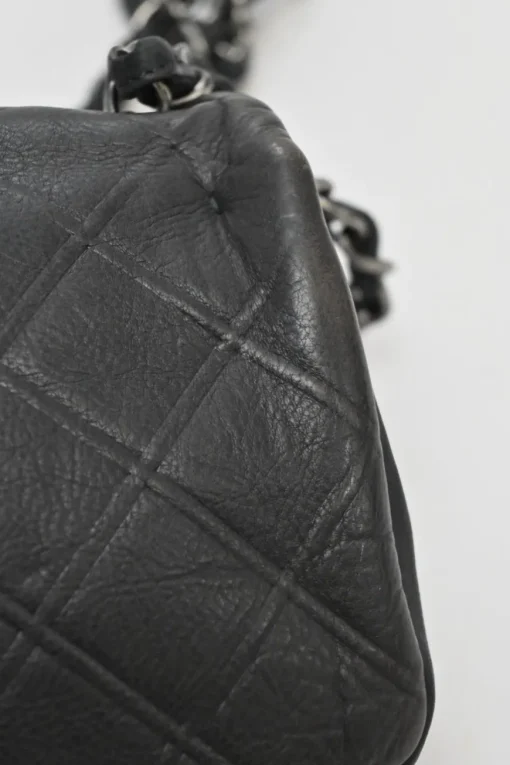 Grey embossed matelassé calfskin crossbody flap bag with gunmetal Coco Mark turnlock closure